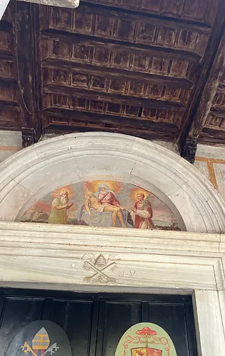 Papal keys carved above a doorway in Santo Stefano Rotondo.